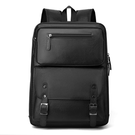Black backpack with multiple pockets and straps on a white background