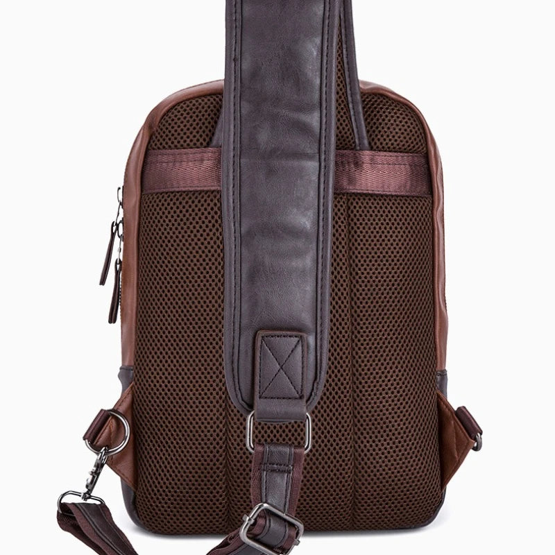Brown backpack with mesh back panel on a white background