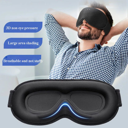 Man wearing a black sleep mask with text on non-eye pressure, shading, and breathability.
