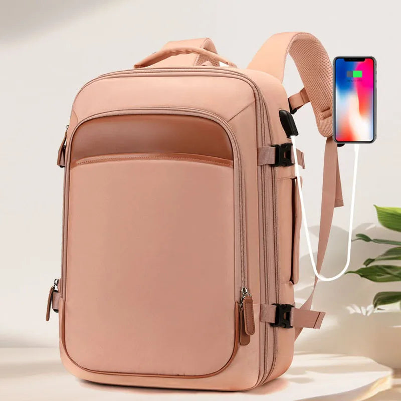 Pink backpack with a phone attached on a light background