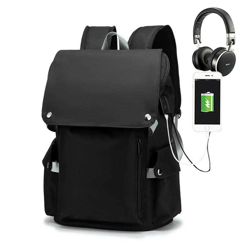 Black backpack with USB charging port, headphones, and smartphone on a white background