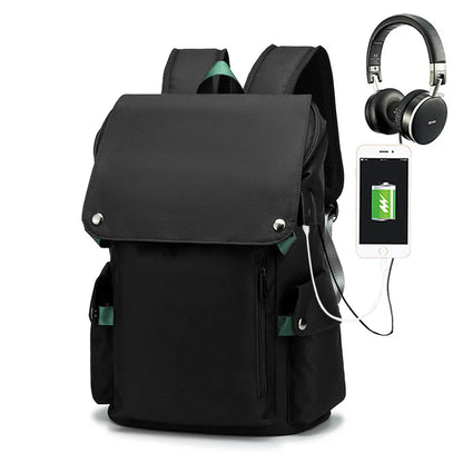 Black backpack with USB charging port, smartphone, and headphones on a white background