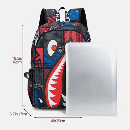 Multicolored backpack with shark mouth design next to a laptop, showing dimensions.