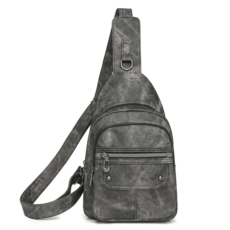 Gray suede sling bag on a white background