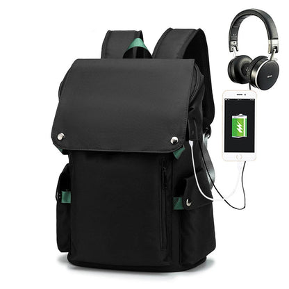 Black backpack with USB charging port, smartphone, and headphones on a white background