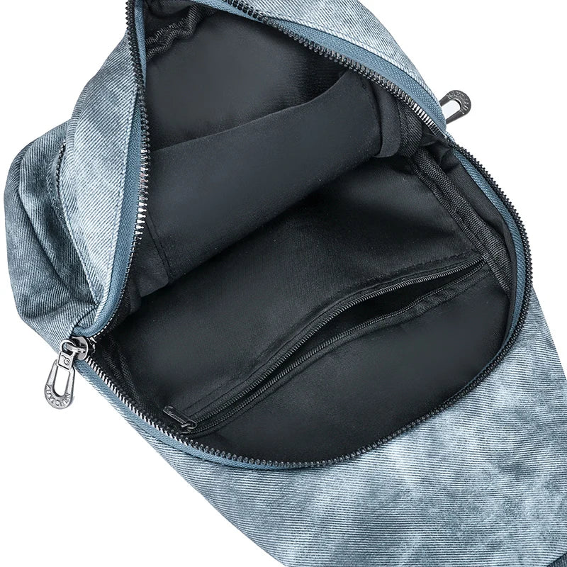 Blue backpack with open zipper showing black interior