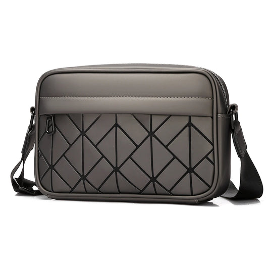 Gray crossbody bag with geometric pattern on a white background