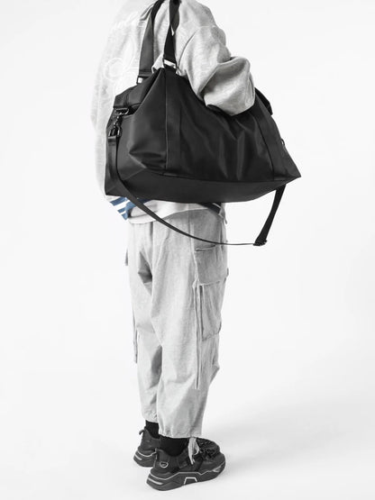 Person wearing a black backpack and gray outfit on a white background