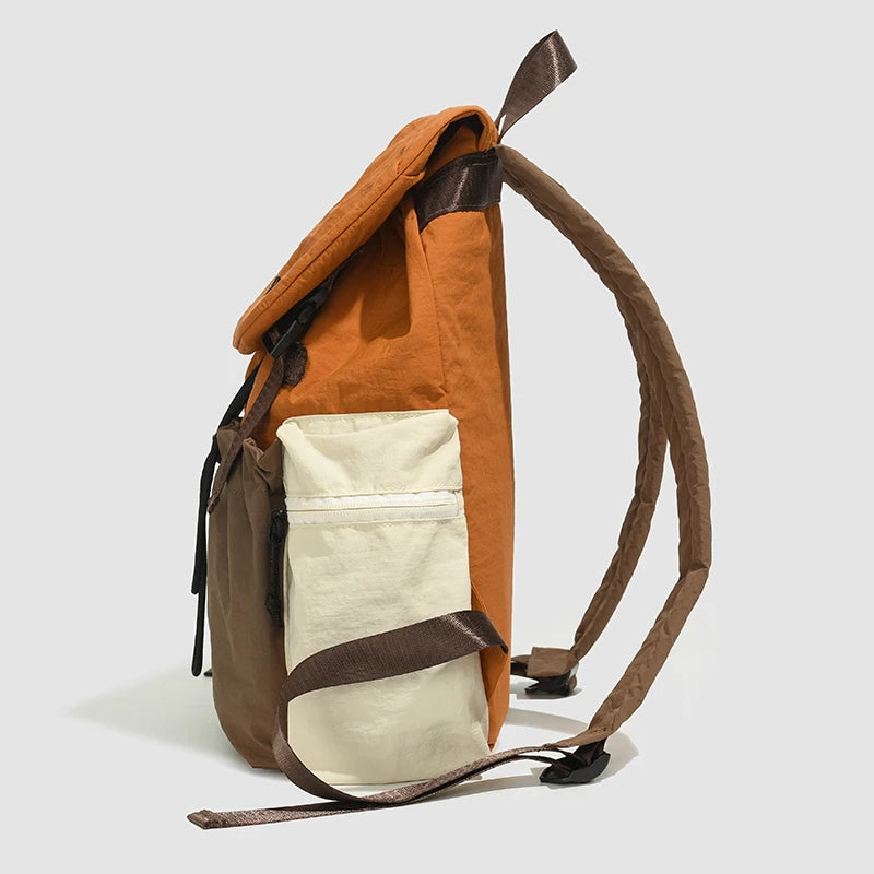 Brown and beige backpack on a light gray background