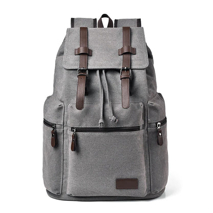 Gray backpack with brown straps and accents on a white background