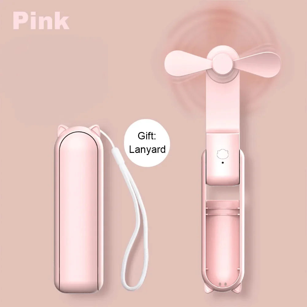 Pink portable fan with carrying case and lanyard on a pink background