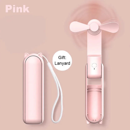 Pink portable fan with carrying case and lanyard on a pink background