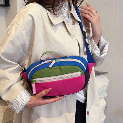 Person holding a colorful waist bag with a neutral background