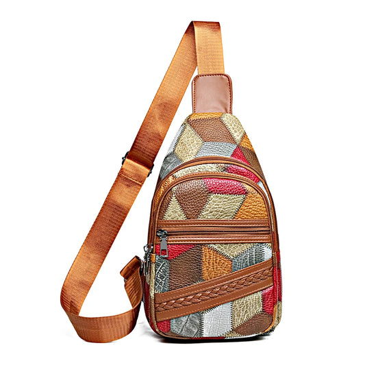 Multicolored patterned sling bag with brown strap on a white background