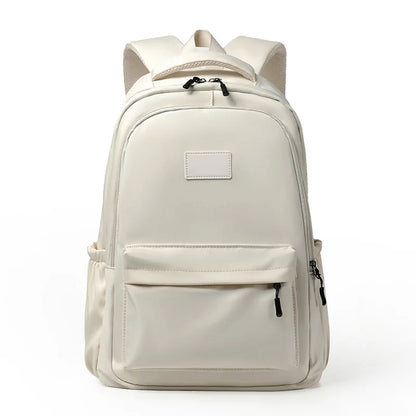 Beige backpack with a front pocket on a white background