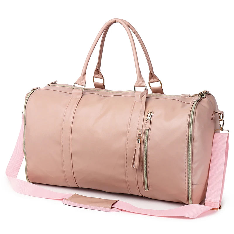 Pink duffel bag with a shoulder strap on a white background