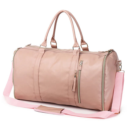 Pink duffel bag with a shoulder strap on a white background