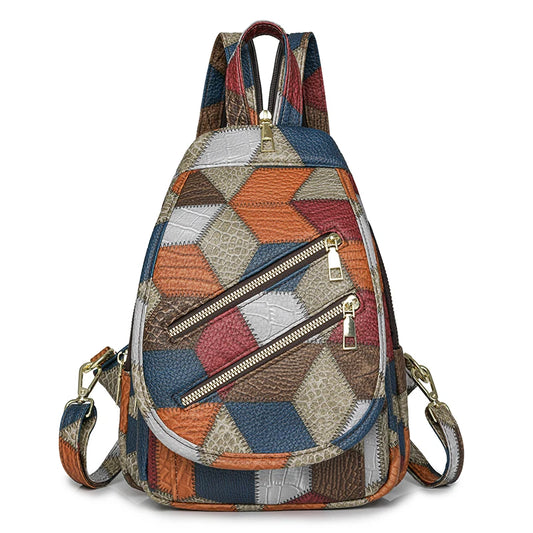 Multicolored patchwork backpack with zippers on a white background