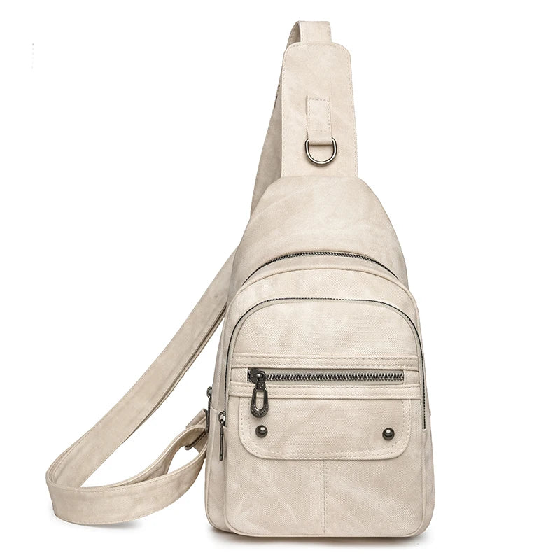 Beige sling bag with multiple pockets on a white background