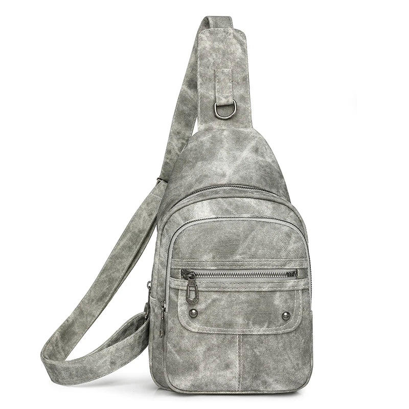 Gray suede sling bag on a white background