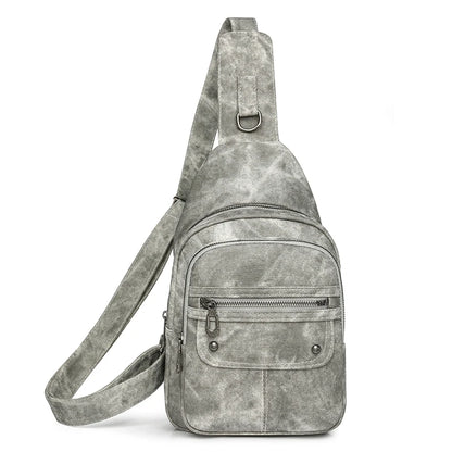 Gray suede sling bag on a white background