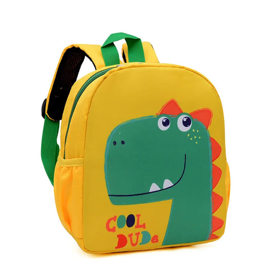 Yellow backpack with a dinosaur design and 'Cool Dude' text on a white background