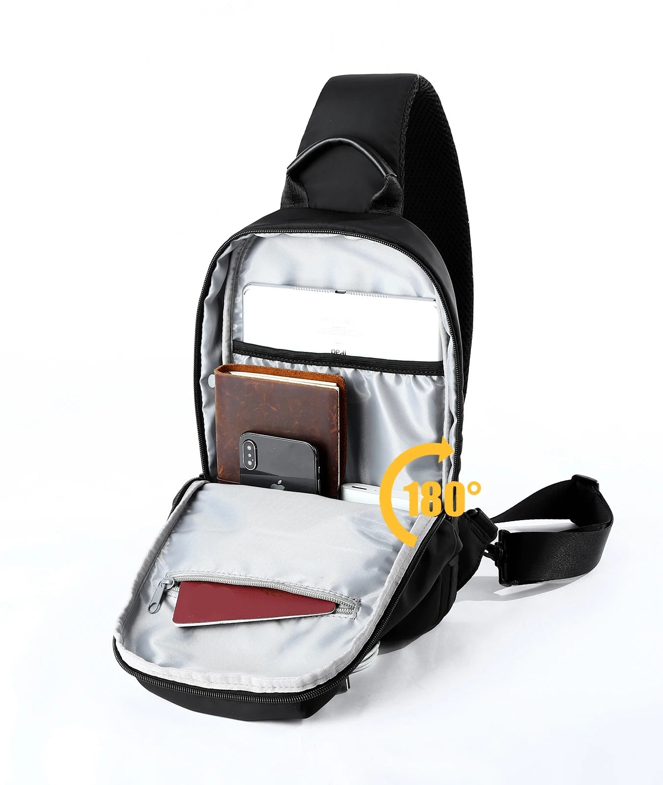 Black and silver crossbody bag with compartments on a white background
