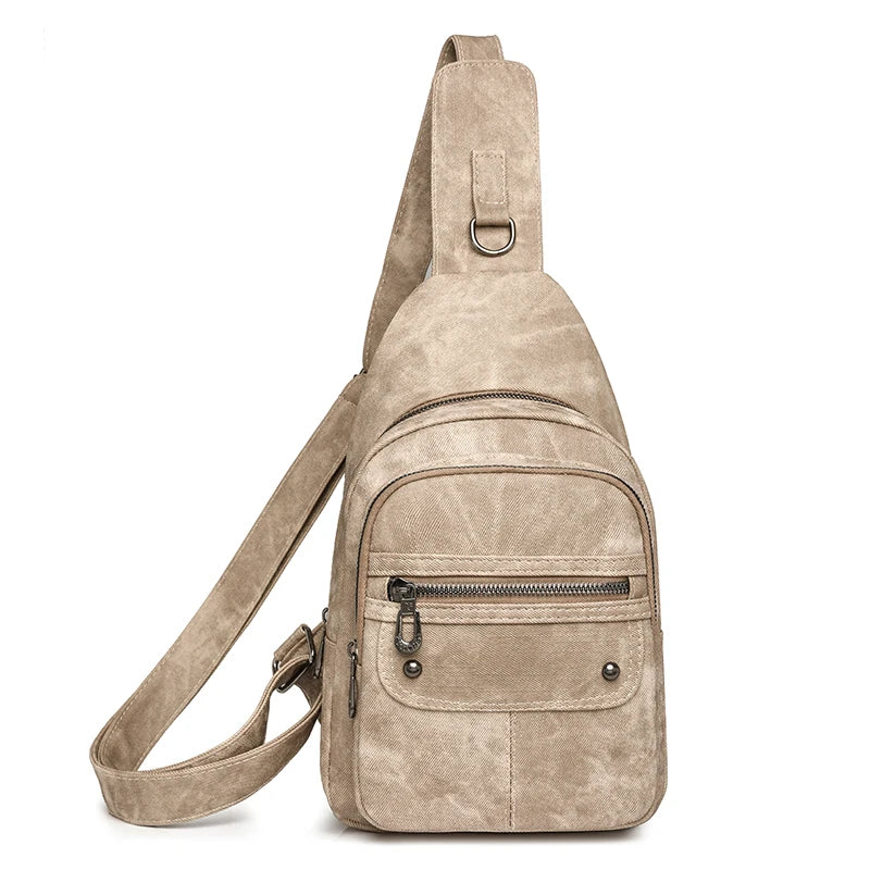 Beige suede sling bag on a white background