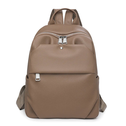 Brown backpack with silver zippers on a white background