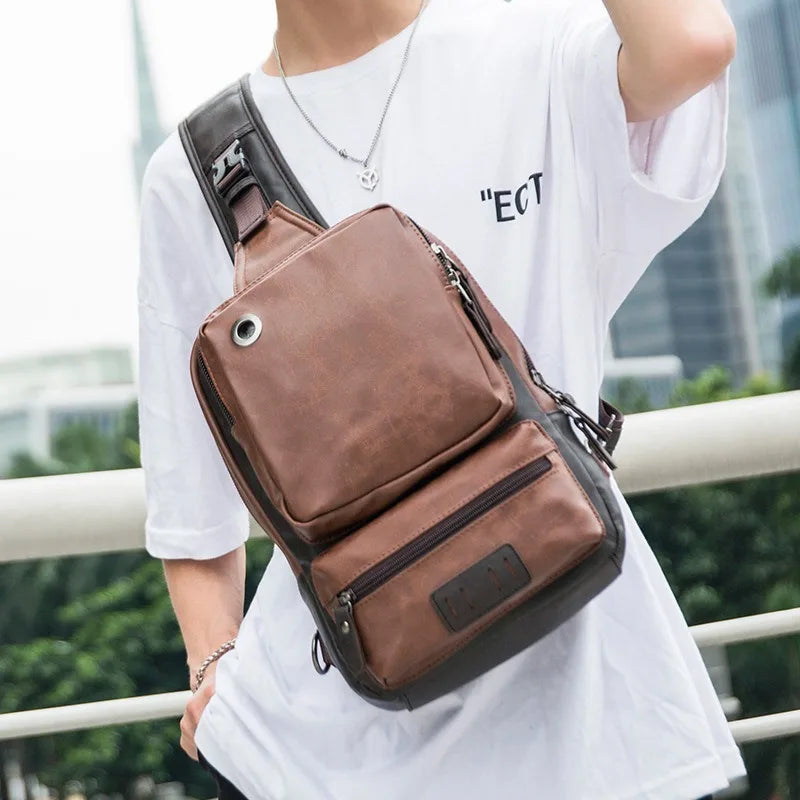Person wearing a brown leather sling bag with a blurred background