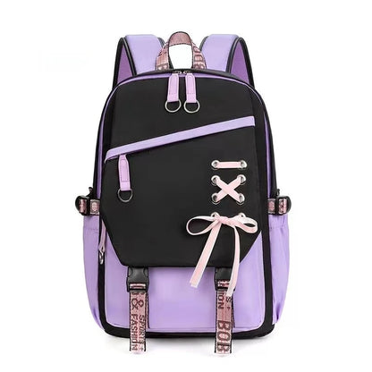 Black and purple backpack with pink accents on a white background