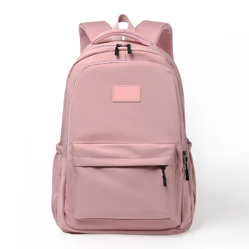 Pink backpack on a white background