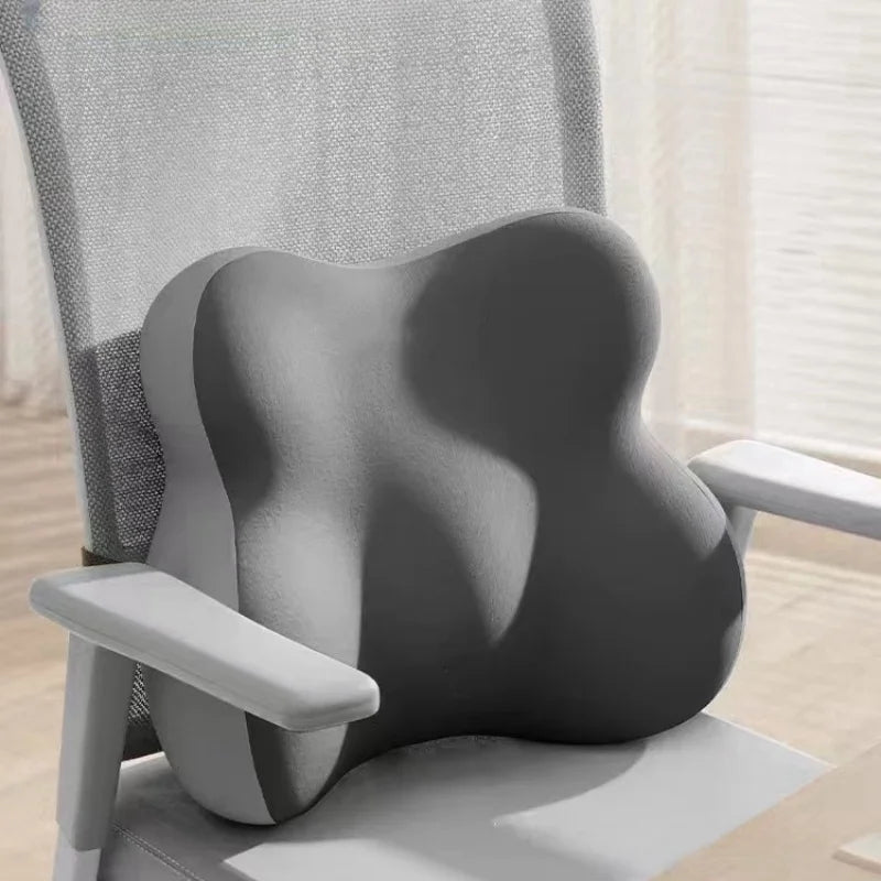 Gray ergonomic chair cushion on a office chair with a neutral background