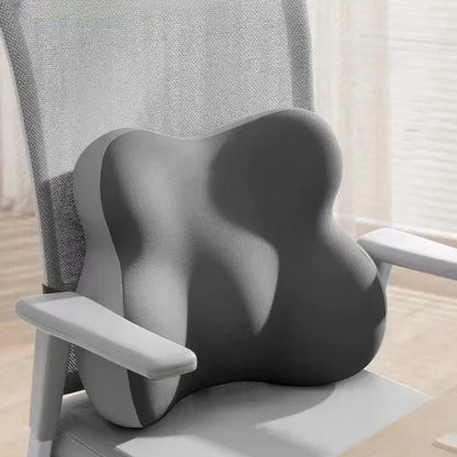 Gray ergonomic chair cushion on a office chair with a neutral background