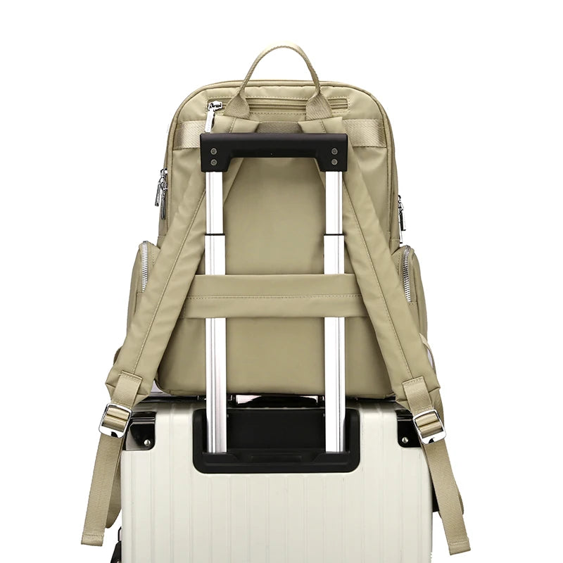 Beige backpack with rolling handle on a white background