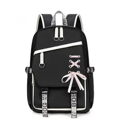 Black backpack with white accents and decorative elements on a white background