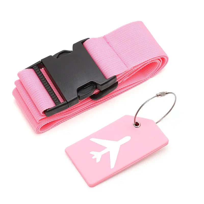 Pink luggage strap with black buckle and pink tag with airplane design on a white background