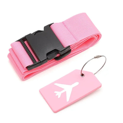 Pink luggage strap with black buckle and pink tag with airplane design on a white background