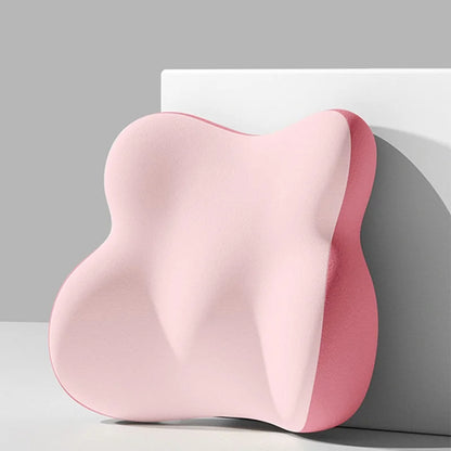 Pink cushion on a white surface with a gray background