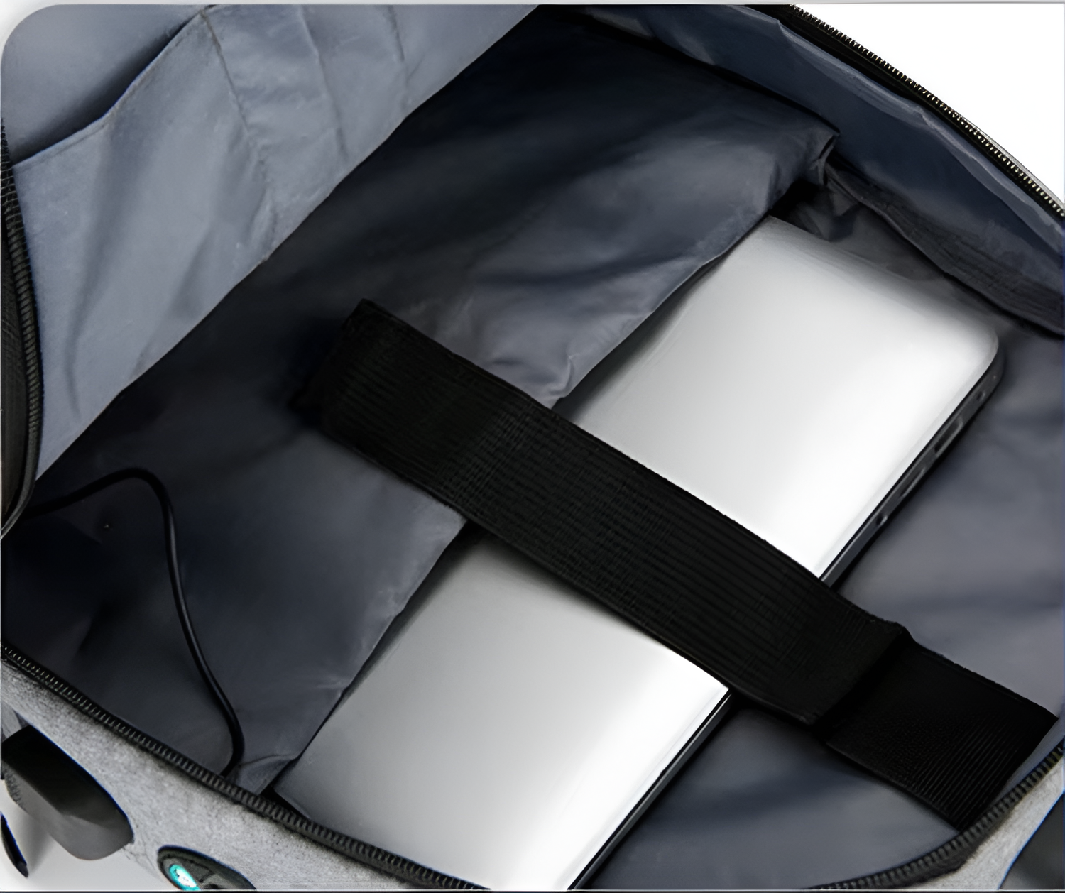 Laptop in a gray bag with a black strap
