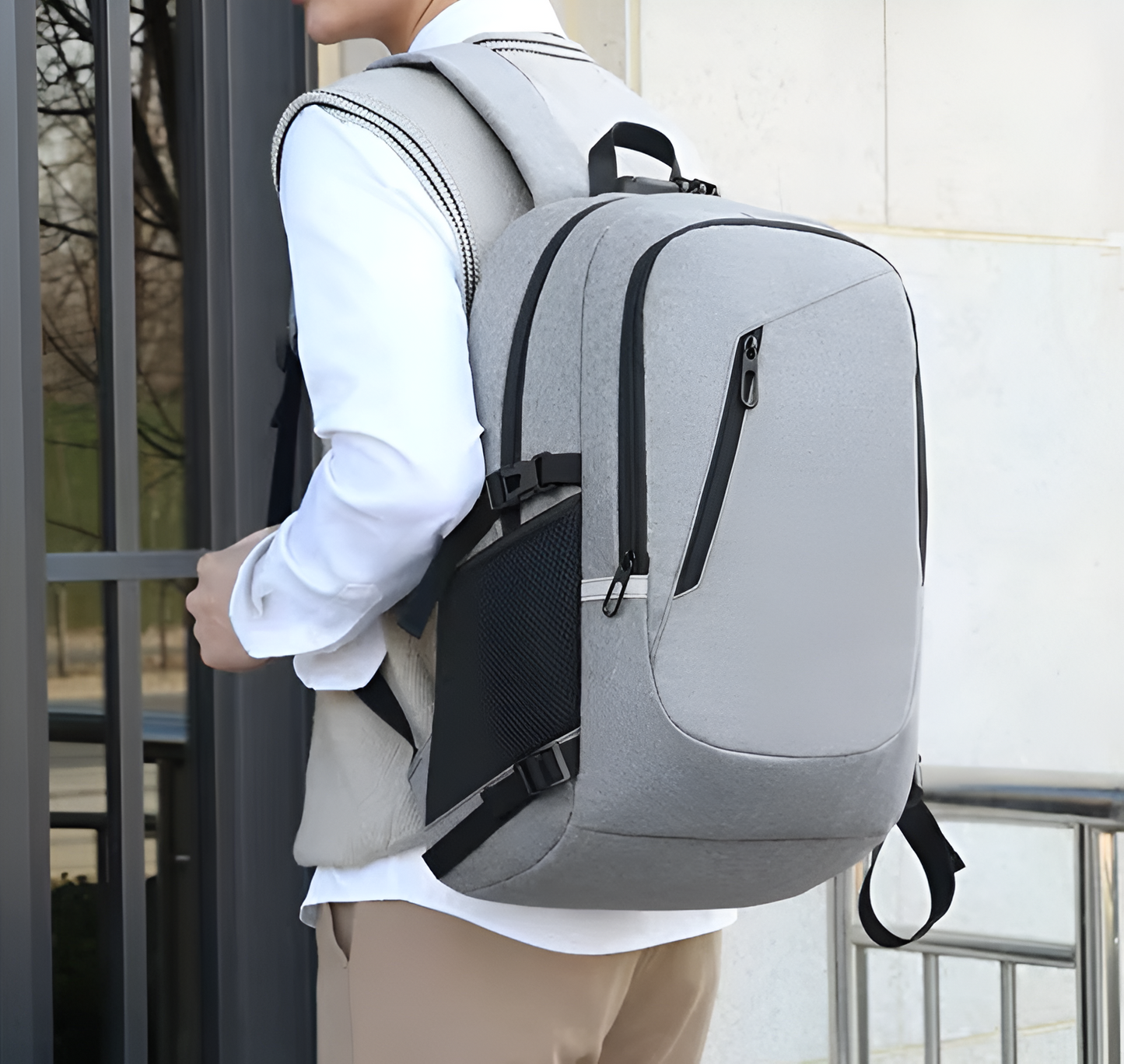 Person wearing a gray backpack outdoors