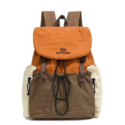 Multicolored backpack with visible brand logo on a white background