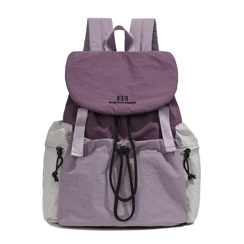 Purple and gray backpack with North Face logo on a white background