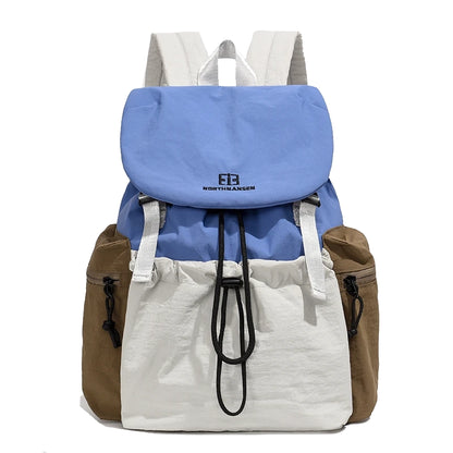 Multicolored backpack with visible brand logo on a white background