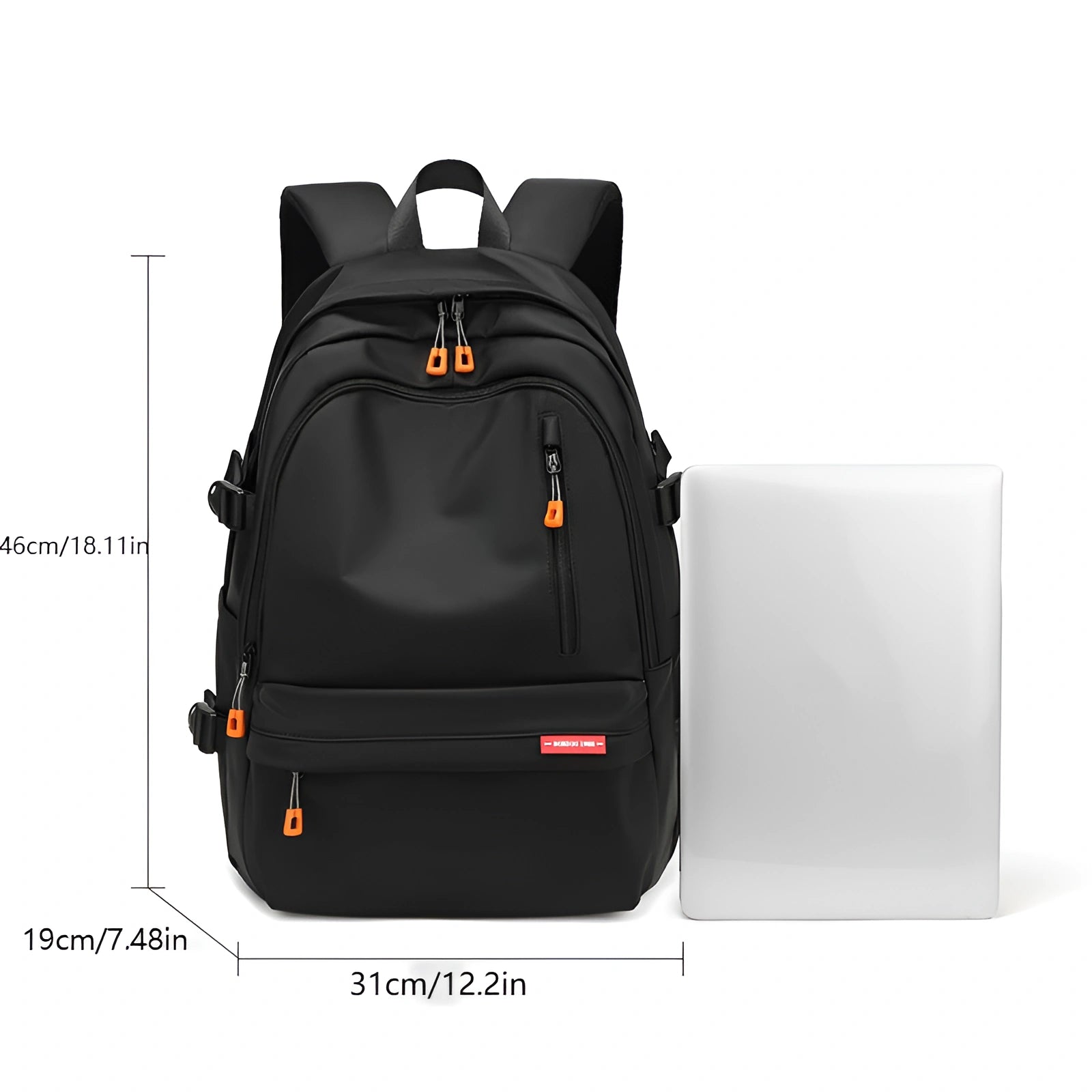 Black backpack with measurements and a laptop for scale on a white background
