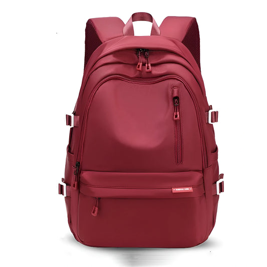 Red backpack on a white background