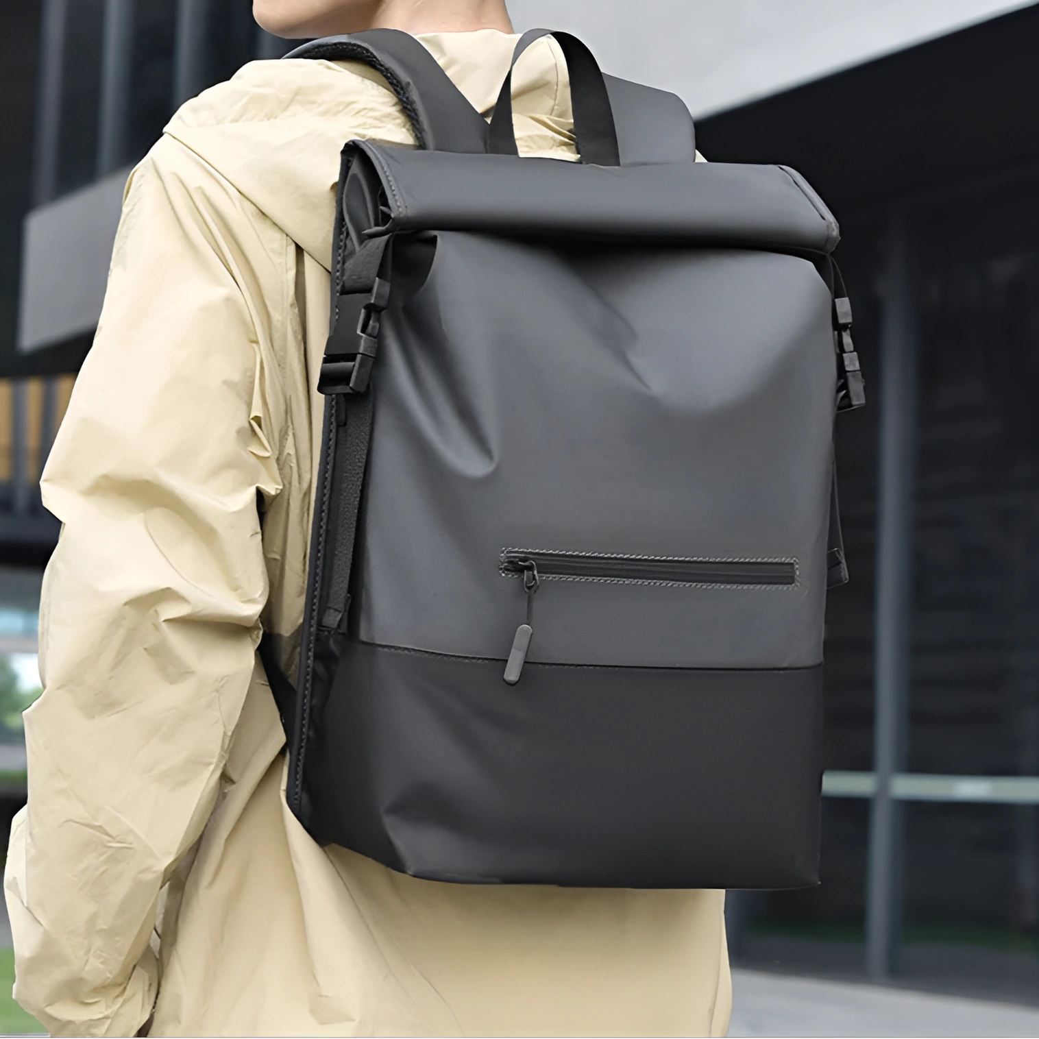 Person wearing a gray and black backpack with a blurred background