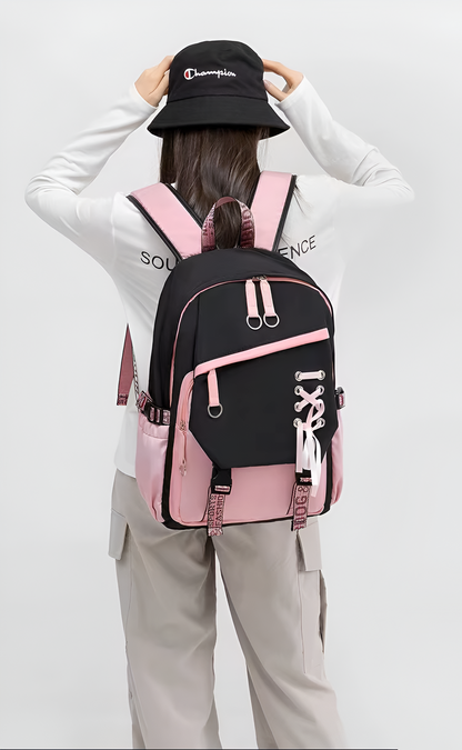 Person wearing a black and pink backpack with a white background