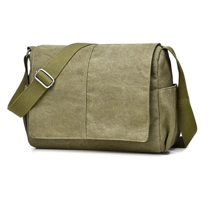 Green canvas messenger bag with a strap on a white background