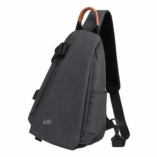 Gray sling bag with brown strap on a white background